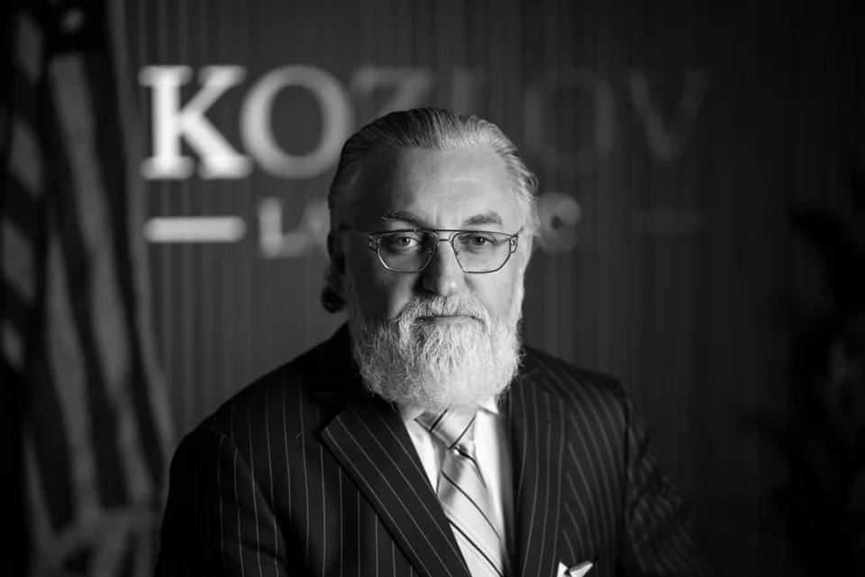 Black-and-white executive portrait in an office