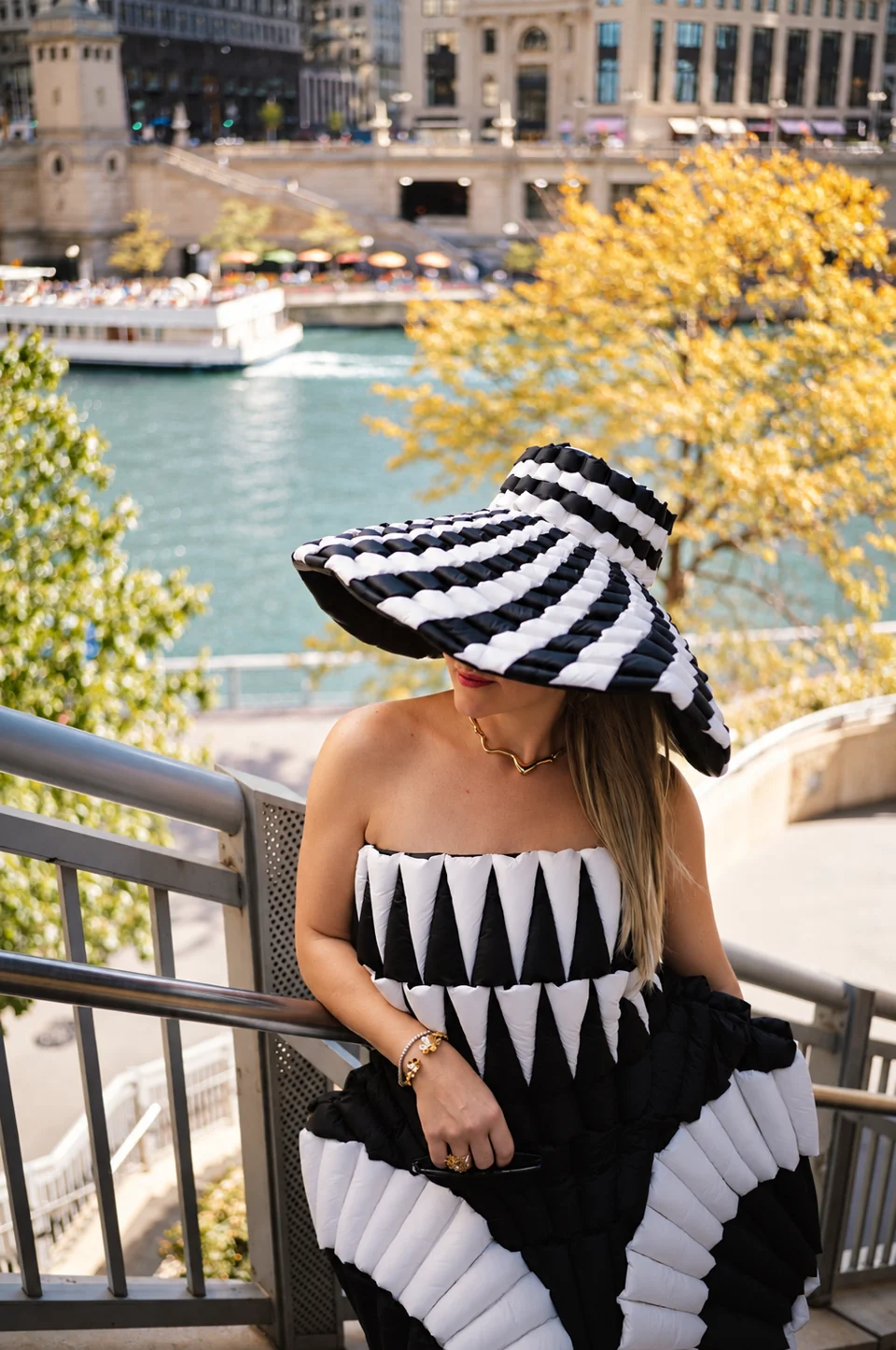 Fashion portrait in a striped outfit above the Chicago river
